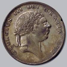 A picture containing object, coin, old

Description automatically generated