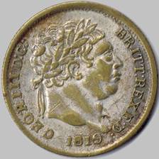 A close-up of a coin

Description automatically generated